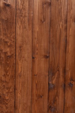 Kahverengi ahşap arka plan. Kır tahtası dokuları. Dikey dokuyu kaplayan ahşap duvar. Dayak yemiş arka plan. Yıpranmış Vintage Surface. Sert Dış Yapı. Eski grunge ahşap kaplama.