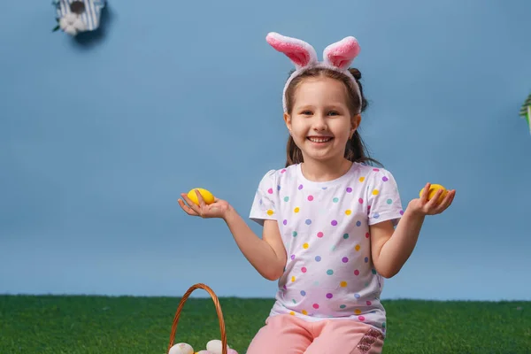 Cute Smiling Little Girl Sits Blue Background Studio Holds Basket — Stock Photo, Image