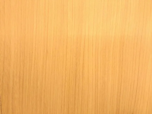 Açık kahverengi ahşap arka planda güzel, dikey ahşap tahıl var. pürüzsüz bir ahşap yüzey malzemesinin kusursuz bir yakın çekimi, tasarım veya döşeme uygulamaları için ideal