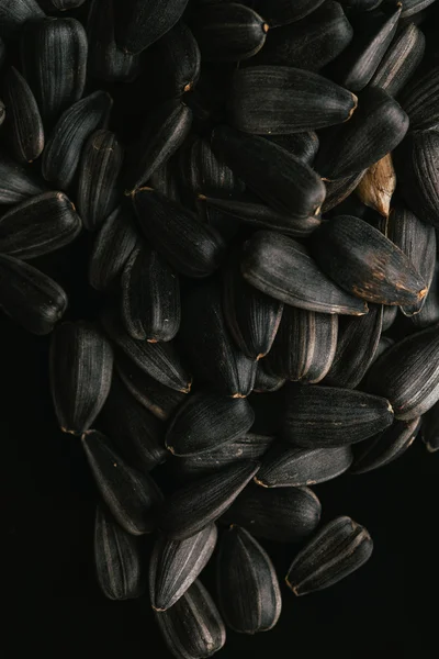 many black sunflower seeds background close up