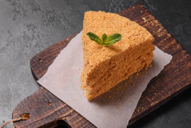 1 piece of honey cake on a board, dessert