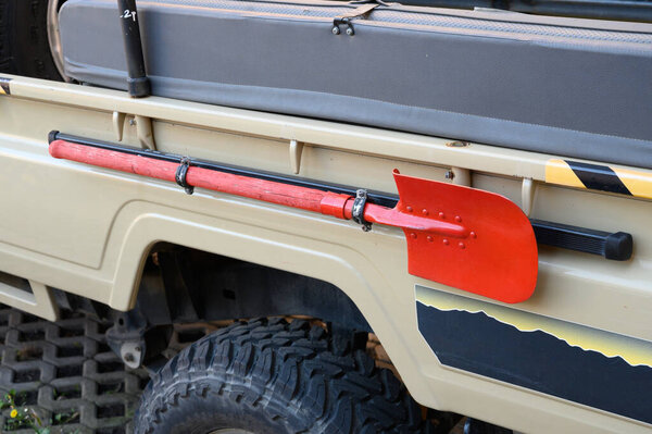 Shovel securely mounted on the SUV body. Perfect for extreme trips, off-road, and outdoor adventures.