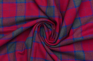 İskoç kumaşında geleneksel tartan deseni. Doku ve dekoratif tasarım için uygun parlak ve detaylı yakın plan.