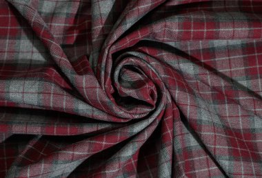 İskoç tarzı yün kumaş, koyu mavi, kırmızı ve yeşil tonlarda kesişen kontrol çizgileri. Ayrıntıları dokumak ve rahatlamak moda ve iç mekan için klasik bir arka plan oluşturur.