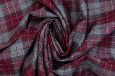 Mavi, yeşil ve sarı gölgeli açık çizgilerle yakın çekim. Pürüzlü yün yüzeyi ve yoğun dokuma aksesuarlar ve iç tasarım için otantik bir arkaplan oluşturur.