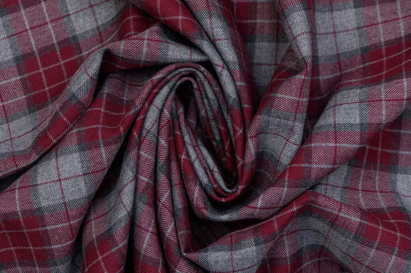 Mavi, yeşil ve sarı gölgeli açık çizgilerle yakın çekim. Pürüzlü yün yüzeyi ve yoğun dokuma aksesuarlar ve iç tasarım için otantik bir arkaplan oluşturur.