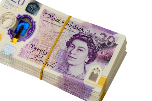 Görüntü, Kraliçe II. Elizabeth 'in portresini içeren 20 sterlinlik İngiliz banknotlarını gösteriyor. Notlar düz bir yüzeyde sergileniyor, tasarım detayları, filigranlar ve güvenlik gösteriliyor.