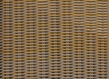 Dokuma koltuğun doğal malzeme dokusuyla yakın çekimi. Ürün fotoğrafçılığı, tasarım ve iç projeler için arka plan olarak mükemmel.