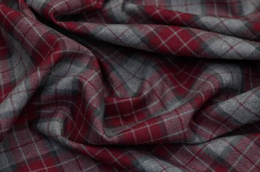 Yeşil, siyah ve beyaz tonlarda yoğun dokuması olan ekosenin yakın çekimi. Sert doku ve kesişen kontroller aksesuarlar ve iç projeler için gerçek bir arkaplan oluşturur.