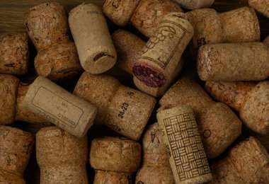 Natural wine and champagne corks arranged as a background. Eco-friendly material, sustainable design concept, close-up texture