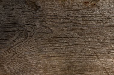 Tahtada düzensizlikler, tırnak izleri ve ezme izleri var. Eskimiş fotoğraflar ve retro tasarım için arka plan olarak gri-kahverengi tonlardaki derin doku mükemmeldir..