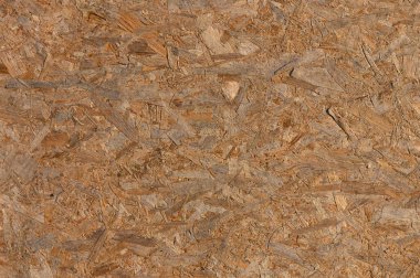 Ahşap bir yüzeyin detaylı bir görüntüsü karmaşık desenleri ve toprak renkleri tasarım ilhamı için mükemmeldir..