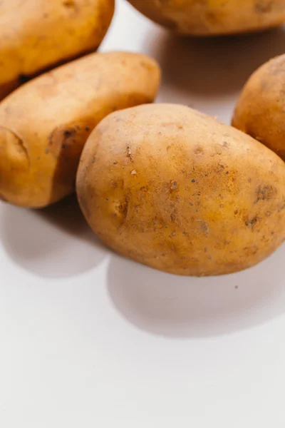 Fresh raw potatoes on a white background — Stock Photo, Image