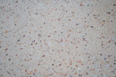 Terrazzo 'nun yakın çekim dokusu ya da açık renkli benekleri olan beton..