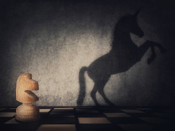 Surreal transformation of the knight chess piece into a wild and powerful unicorn. Motivation and self confidence metaphor, overcoming obstacles and achieving success. Leadership and freedom concept