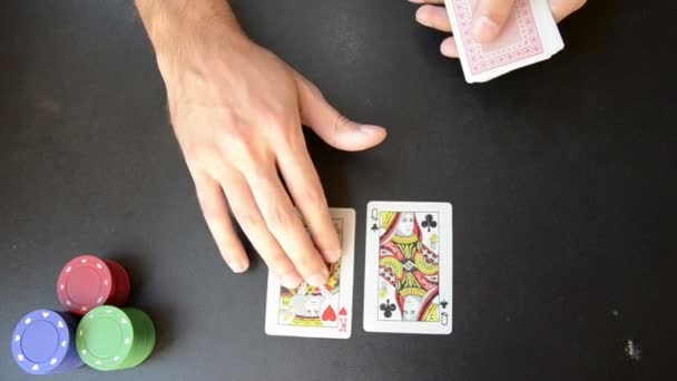 Man plaing poker on black board — Stock Video