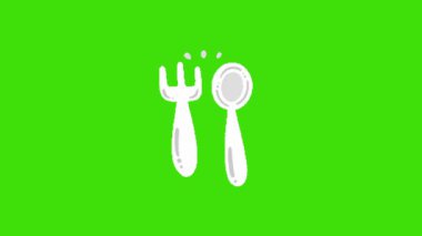 Fork and spoon on green background