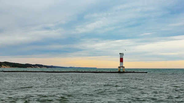 Lighthouse on breakwater with seagulls in Holland Michigan