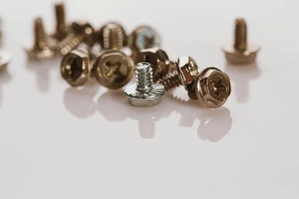 Screws for a computer on white background — Stock Photo, Image