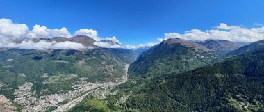Alpine valley with a winding river surrounded by mountains, Savoie, Auvergne-Rhone-Alpes, France, Europe. 