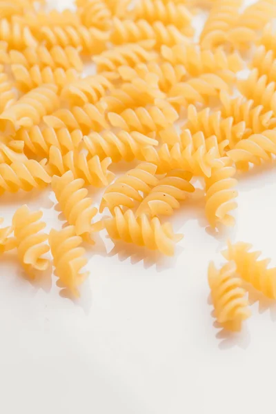 Dry Italian pasta on a white background — Stock Photo, Image