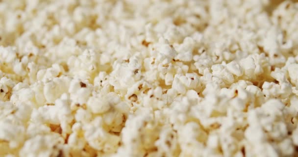 Delicious popcorn on a rotating background — Stock Video