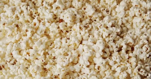 Delicious popcorn on a rotating background — Stock Video