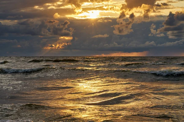 Epic dark sunset sky above the sea shore after the storm. — Stockfoto