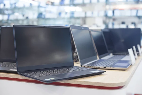 Laptops on the table in the electronics store.