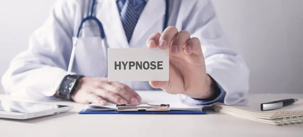 Doctor Showing Hypnose Word Business Card Stock Photo