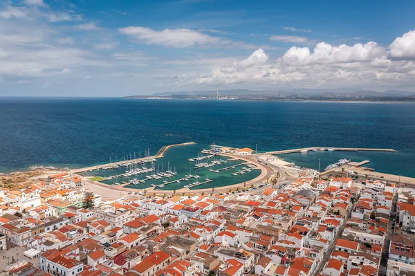 Coastal Town Aerial View With Beach, Turquoise Water, and Red-Tiled Houses Overlooking the Sea,Sardinia,Italy