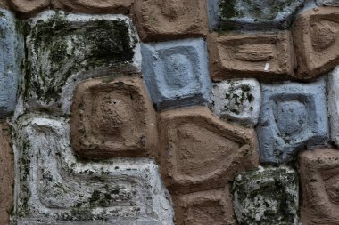 Earthy stone texture in browns and greys. Rustic and aged, this wall surface brings a natural, organic feel to backgrounds and design projects. Inspiring texture.