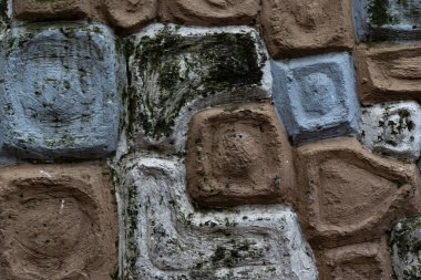 Unique stone wall background with geometric shapes and earthy textures. Perfect for architectural designs, rustic themes, or adding natural elements to projects.