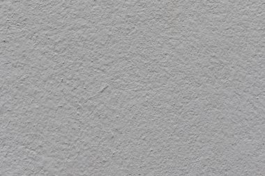 Versatile gray stucco wall texture for backgrounds, designs, and projects. A neutral, modern backdrop with subtle details and a rough, textured surface.