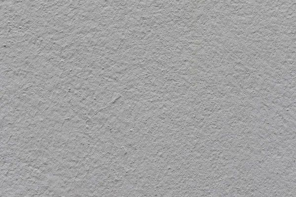 Versatile gray stucco wall texture for backgrounds, designs, and projects. A neutral, modern backdrop with subtle details and a rough, textured surface.