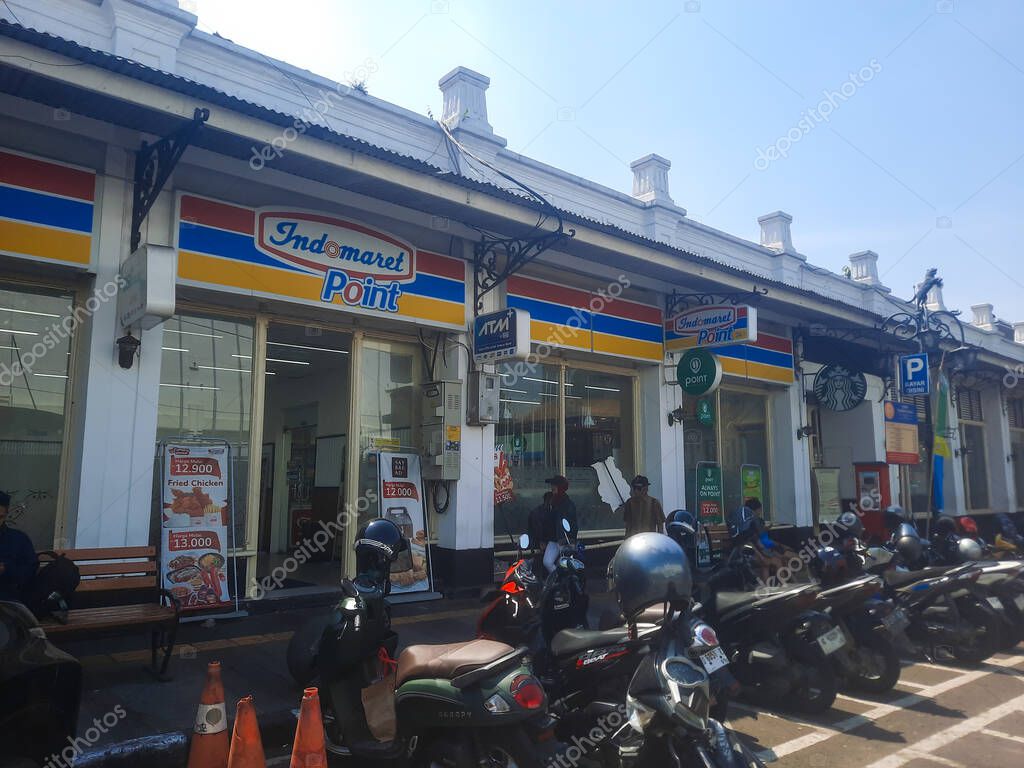 Bandung, Indonesia - October 16, 2025: Indomaret Point and urban shopping scene bustling with visitors
