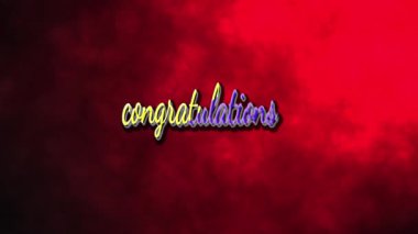 Kırmızı arka planda sarı ve mor renkli tebrikler.