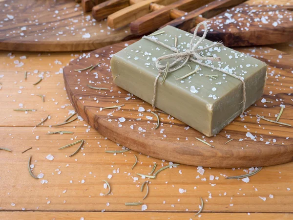 Soap bar on the olive tree textured board — Stock Photo, Image