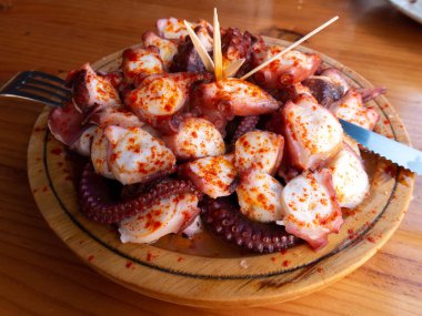 Polbo a feira meaning fair-style octopus in gallego or pulpo a la gallega in Spanish meaning Galician-style octopus a traditional Galician dish 
