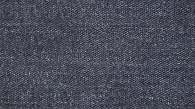 Koyu mavi kot kumaş dokusu kopyalama alanı olan basit bir arkaplan olarak kullanılır. Klasik kot pantolon tekstil yüzeyi moda, giyim markası ve ürün sunumu için idealdir.