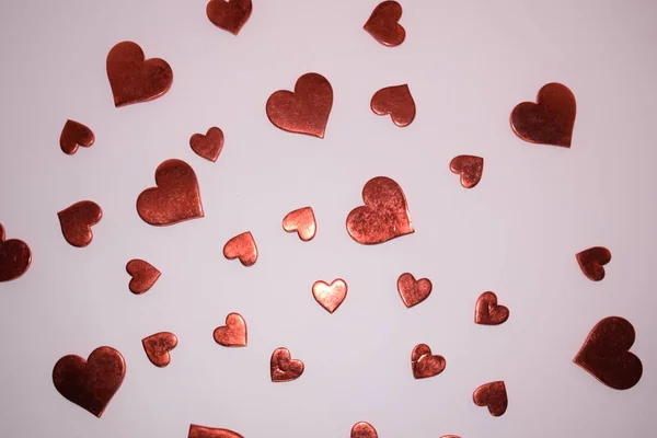 Sevgililer Günü geçmişi. Pembe arka planda kırmızı kalpler.