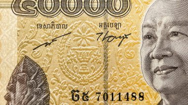 50.000 Kamboçyalı isyan banknotunun makro fotoğrafı. Kamboçya kağıt parasının ayrıntılı parçası ulusal para biriminin portresini ve güvenlik özelliklerini gösteriyor.
