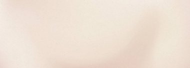 Ilık bej tonları ve altın parıltısıyla yumuşak pembe bir eğim. Zarif pastel arka planda yumuşak şampanya renkleri, lüks kozmetik ve moda projeleri için mükemmel.