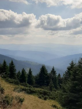 beautiful landscape with a mountain in the background..and there are clouds above Goverla