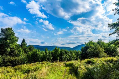 green mountain landscape with a beautiful blue sky.