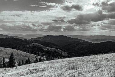 the mountain and the black and white photo from the top of the mountain. the carpathian mountains, in ukraine.
