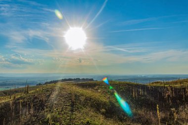 view of the beautiful landscape with the sun and the sky