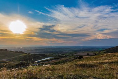 amazing view of sunset over hills in tuscany, italy