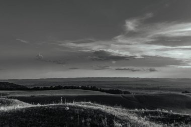 a beautiful shot of the hills and trees on a black background