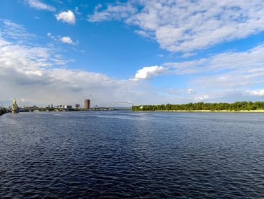 view of the river with a city on a summer day, the city of the dnepro